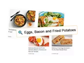 An illustration showing a search result for 'Eggs, Bacon and Fried Potatoes.' The image features a magnifying glass icon next to the search text. Below the search bar, there are four images of food: two bowls of a fried dish with utensils, a dish with fried eggs and greens, and a breakfast sandwich. Captions include phrases like 'Tantalizing Fried' and 'Delicious Fried Egg Sandwich - Try Our Best Recipe Now!' representing customized content discovery related to breakfast dishes.